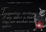 Image of error checking in produced stockings United States USA, 1920, second 8 stock footage video 65675035762