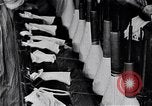 Image of error checking in produced stockings United States USA, 1920, second 22 stock footage video 65675035762