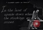 Image of error checking in produced stockings United States USA, 1920, second 30 stock footage video 65675035762