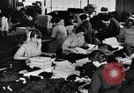 Image of error checking in produced stockings United States USA, 1920, second 48 stock footage video 65675035762