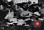 Image of error checking in produced stockings United States USA, 1920, second 49 stock footage video 65675035762