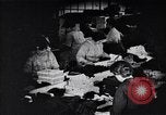 Image of error checking in produced stockings United States USA, 1920, second 52 stock footage video 65675035762