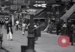 Standbild belebten Markt Geschäfte und Straßen Harlem New York City USA, 1937, aus Sekunde 9 historischem Filmmaterial Videoclip 65675035839