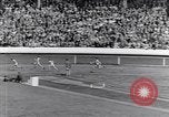 Image of track events between the USA and Britain London England United Kingdom, 1936, second 37 stock footage video 65675035855