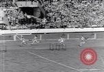 Image of track events between the USA and Britain London England United Kingdom, 1936, second 41 stock footage video 65675035855