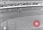 Image of track events between the USA and Britain London England United Kingdom, 1936, second 55 stock footage video 65675035855
