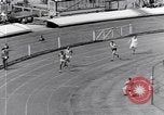 Image of track events between the USA and Britain London England United Kingdom, 1936, second 58 stock footage video 65675035855