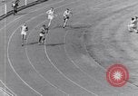 Image of track events between the USA and Britain London England United Kingdom, 1936, second 60 stock footage video 65675035855