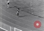 Image of track events between the USA and Britain London England United Kingdom, 1936, second 62 stock footage video 65675035855