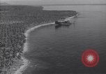 Image of coast line and forests Guadalcanal Solomon Islands, 1943, second 38 stock footage video 65675036177