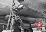 Image of B-29 bomber repaired Iwo Jima, 1945, second 53 stock footage video 65675036224