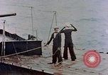 Image of HMIS SUTLEJ sinking Japanese submarine I-155 Japan, 1946, second 36 stock footage video 65675036522
