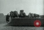 Image of native man leads camel herd Iran, 1908, second 1 stock footage video 65675036728