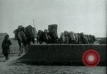 Image of native man leads camel herd Iran, 1908, second 3 stock footage video 65675036728