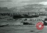 Image of native man leads camel herd Iran, 1908, second 10 stock footage video 65675036728