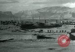 Image of native man leads camel herd Iran, 1908, second 11 stock footage video 65675036728