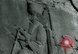Image of native man leads camel herd Iran, 1908, second 27 stock footage video 65675036728