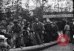 Image of man stands on wooden log Japan, 1900, second 6 stock footage video 65675036777