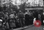 Image of man stands on wooden log Japan, 1900, second 8 stock footage video 65675036777