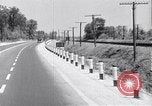 Image of signs on American highways United States USA, 1932, second 19 stock footage video 65675036982