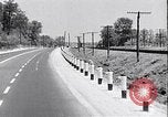 Image of signs on American highways United States USA, 1932, second 23 stock footage video 65675036982