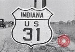 Image of signs on American highways United States USA, 1932, second 33 stock footage video 65675036982