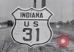 Image of signs on American highways United States USA, 1932, second 34 stock footage video 65675036982