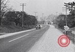 Image of signs on American highways United States USA, 1932, second 38 stock footage video 65675036982