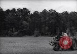 Image of farmer plows farm on tractor Savannah Georgia USA, 1939, second 10 stock footage video 65675037006