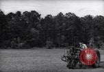 Image of farmer plows farm on tractor Savannah Georgia USA, 1939, second 11 stock footage video 65675037006