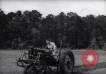 Image of farmer plows farm on tractor Savannah Georgia USA, 1939, second 17 stock footage video 65675037006