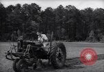 Image of farmer plows farm on tractor Savannah Georgia USA, 1939, second 18 stock footage video 65675037006