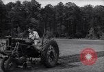 Image of farmer plows farm on tractor Savannah Georgia USA, 1939, second 19 stock footage video 65675037006