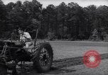 Image of farmer plows farm on tractor Savannah Georgia USA, 1939, second 20 stock footage video 65675037006