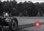 Image of farmer plows farm on tractor Savannah Georgia USA, 1939, second 21 stock footage video 65675037006