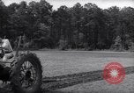 Image of farmer plows farm on tractor Savannah Georgia USA, 1939, second 22 stock footage video 65675037006