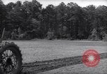 Image of farmer plows farm on tractor Savannah Georgia USA, 1939, second 23 stock footage video 65675037006