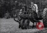 Image of farmer plows farm on tractor Savannah Georgia USA, 1939, second 31 stock footage video 65675037006