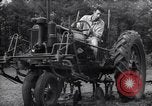 Image of farmer plows farm on tractor Savannah Georgia USA, 1939, second 33 stock footage video 65675037006