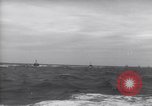 Image of Elements of Allied D-Day invasion fleet underway in World War II English Channel, 1944, second 56 stock footage video 65675037054