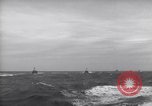 Image of Elements of Allied D-Day invasion fleet underway in World War II English Channel, 1944, second 59 stock footage video 65675037054
