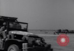 Image of U.S. war supplies come ashore at Normandy after D-Day Normandy France, 1944, second 25 stock footage video 65675037056
