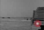 Image of U.S. war supplies come ashore at Normandy after D-Day Normandy France, 1944, second 27 stock footage video 65675037056