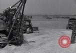 Image of U.S. war supplies come ashore at Normandy after D-Day Normandy France, 1944, second 33 stock footage video 65675037056