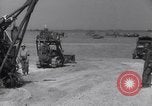 Image of U.S. war supplies come ashore at Normandy after D-Day Normandy France, 1944, second 34 stock footage video 65675037056