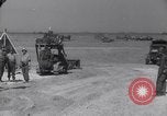 Image of U.S. war supplies come ashore at Normandy after D-Day Normandy France, 1944, second 35 stock footage video 65675037056