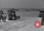 Image of U.S. war supplies come ashore at Normandy after D-Day Normandy France, 1944, second 37 stock footage video 65675037056