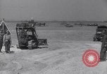 Image of U.S. war supplies come ashore at Normandy after D-Day Normandy France, 1944, second 38 stock footage video 65675037056