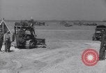 Image of U.S. war supplies come ashore at Normandy after D-Day Normandy France, 1944, second 39 stock footage video 65675037056