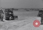 Image of U.S. war supplies come ashore at Normandy after D-Day Normandy France, 1944, second 40 stock footage video 65675037056